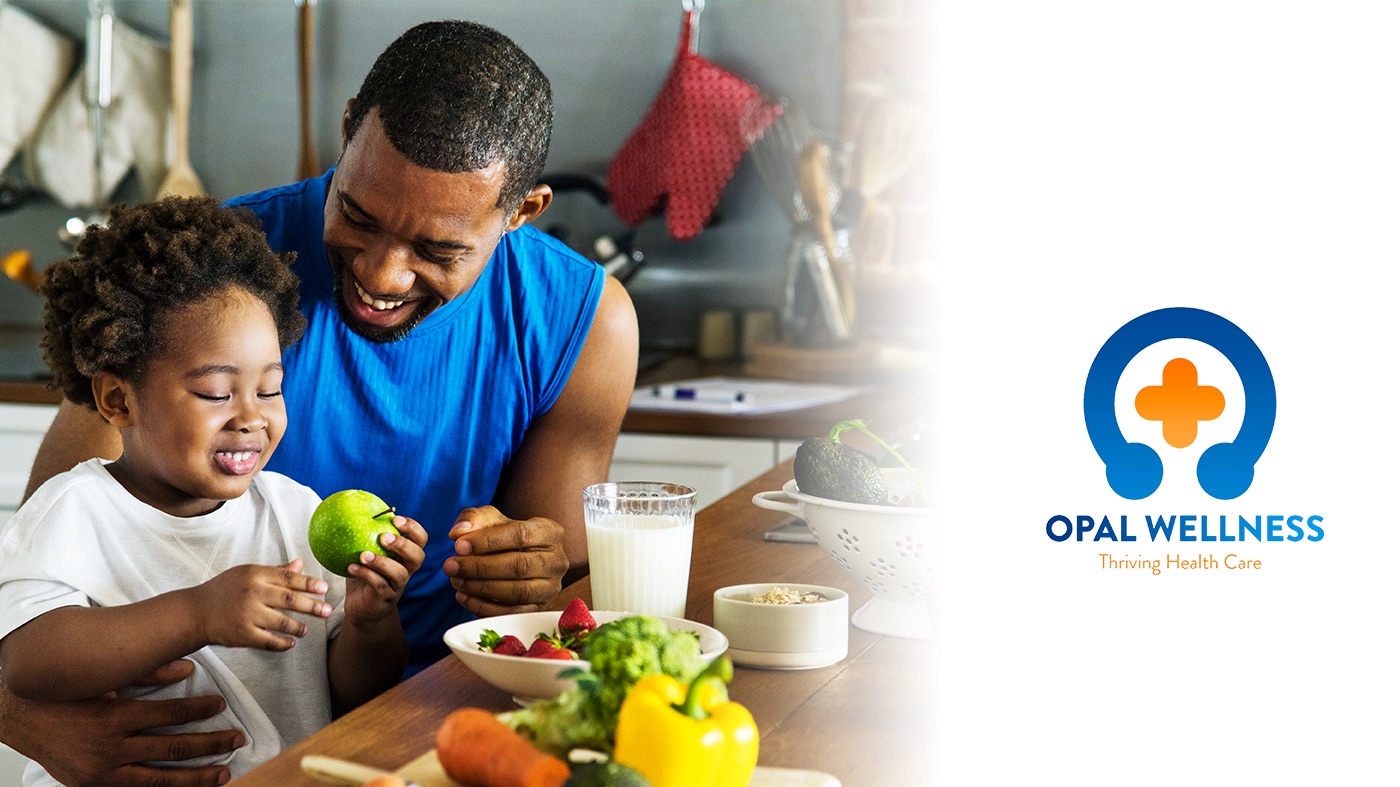 A father and child preparing fresh food together, from the Opal Wellness brand photography